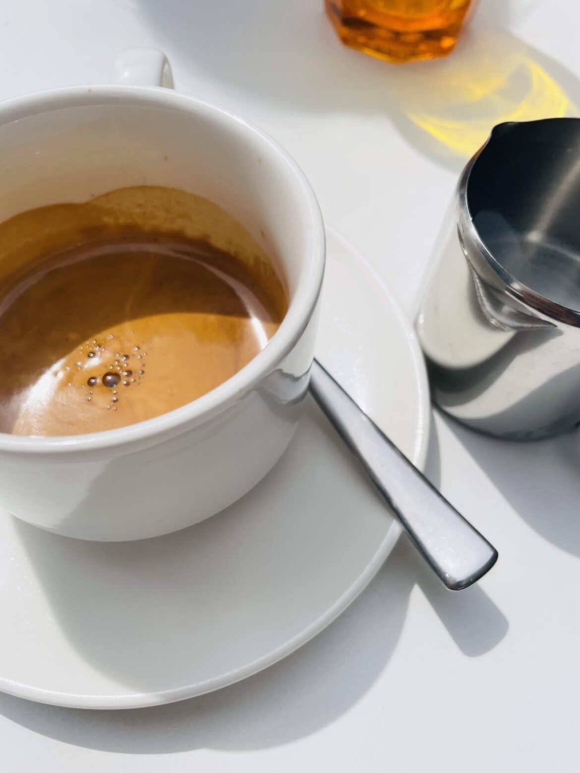 My favourite café serves coffee as espressos, with a pitcher of hot water on the side.