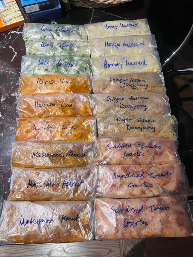Meal prepping marinaded Chicken breast portions for the freezer!