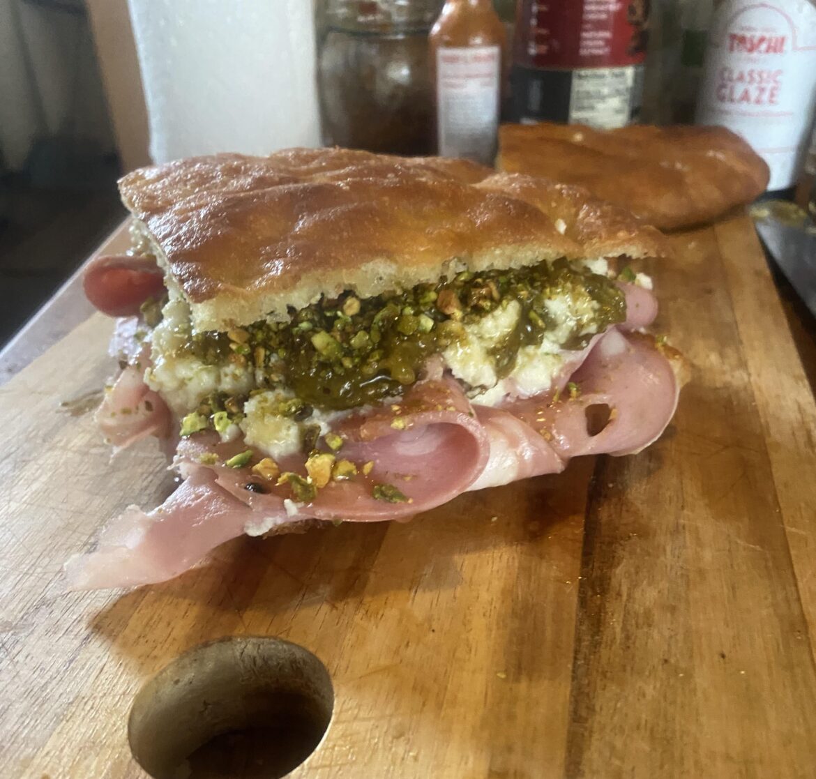 I’m starting a small sandwich shop here soon and doing a little heat check. Who would eat this schiacciata sandwich with mortadella, stracciatella, pistachio pesto, crushed pistachios, and honey?