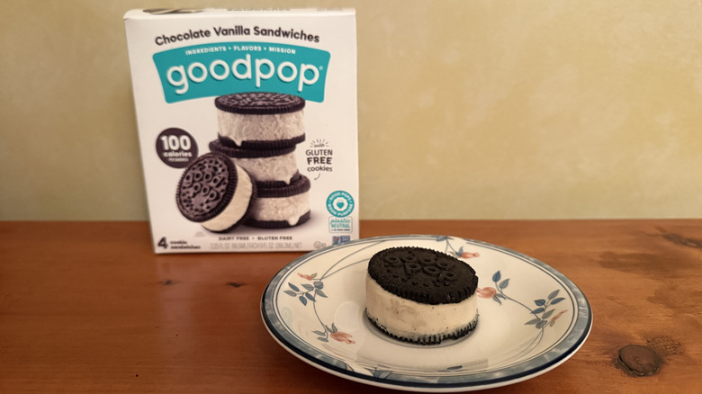 Chocolate vanilla sandwich on plate in front of box