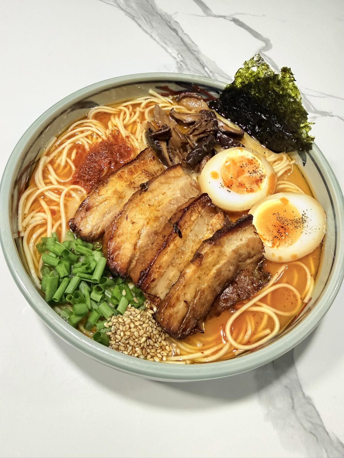 spicy miso ramen with chashu, jammy eggs, mushrooms, and nori