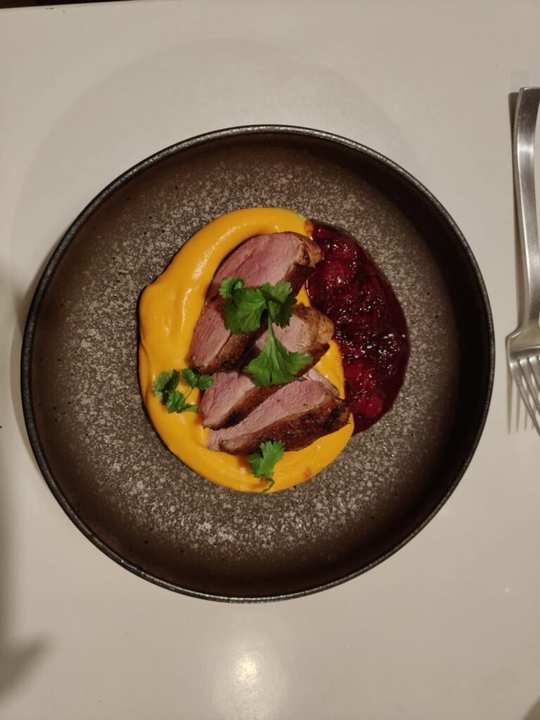 Duck, sweet potato puree and cherry, shallot and cumin sauce
