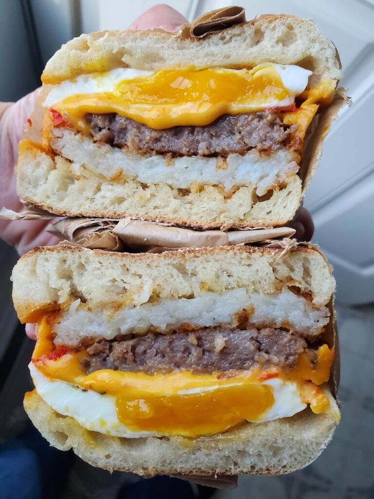 Breakfast meal prep. Sausage egg cheese with hashbrown patty on English muffin.