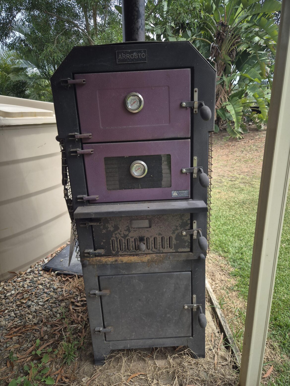 Wood fire pizza oven came with my property, can I smoke meats?