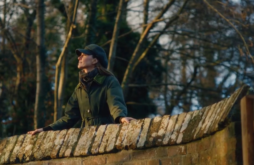 Kate Middleton standing on a bridge