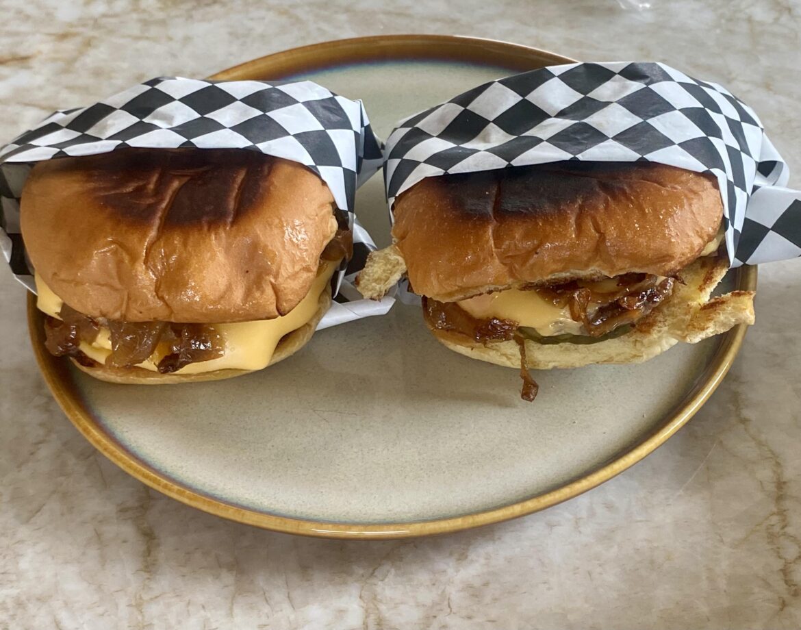 Two singles , American cheese, caramelized onions, special sauce and pickles, smash burgers.