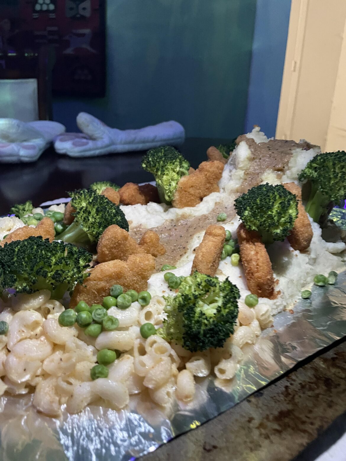 Mashed potato volcano with gravy lava, Dino nuggets, and broccoli trees. Preceded by a bunch of Seagram’s gin