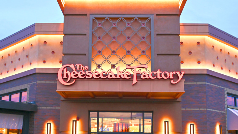 The Cheesecake Factory restaurant lit up at twilight