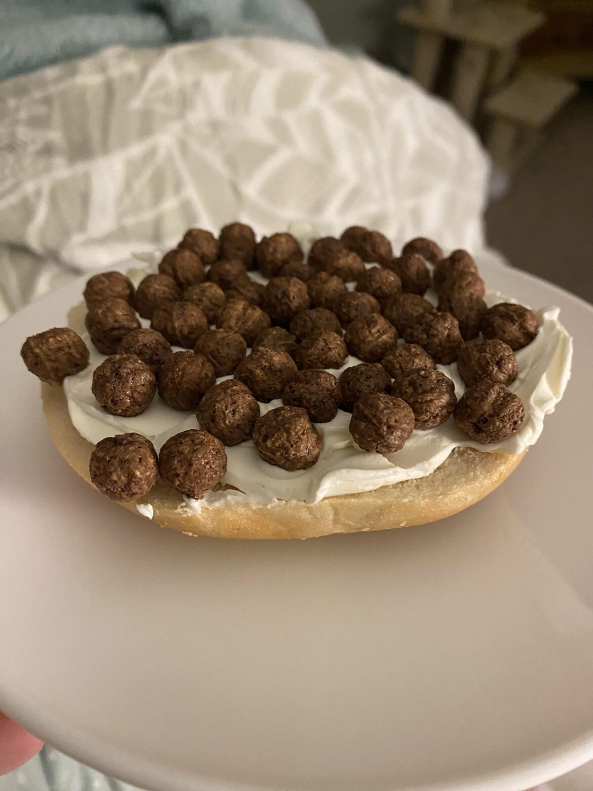 [homemade] Today is my birthday so I made myself a favorite childhood treat- untoasted bagel with cream cheese and coco puffs