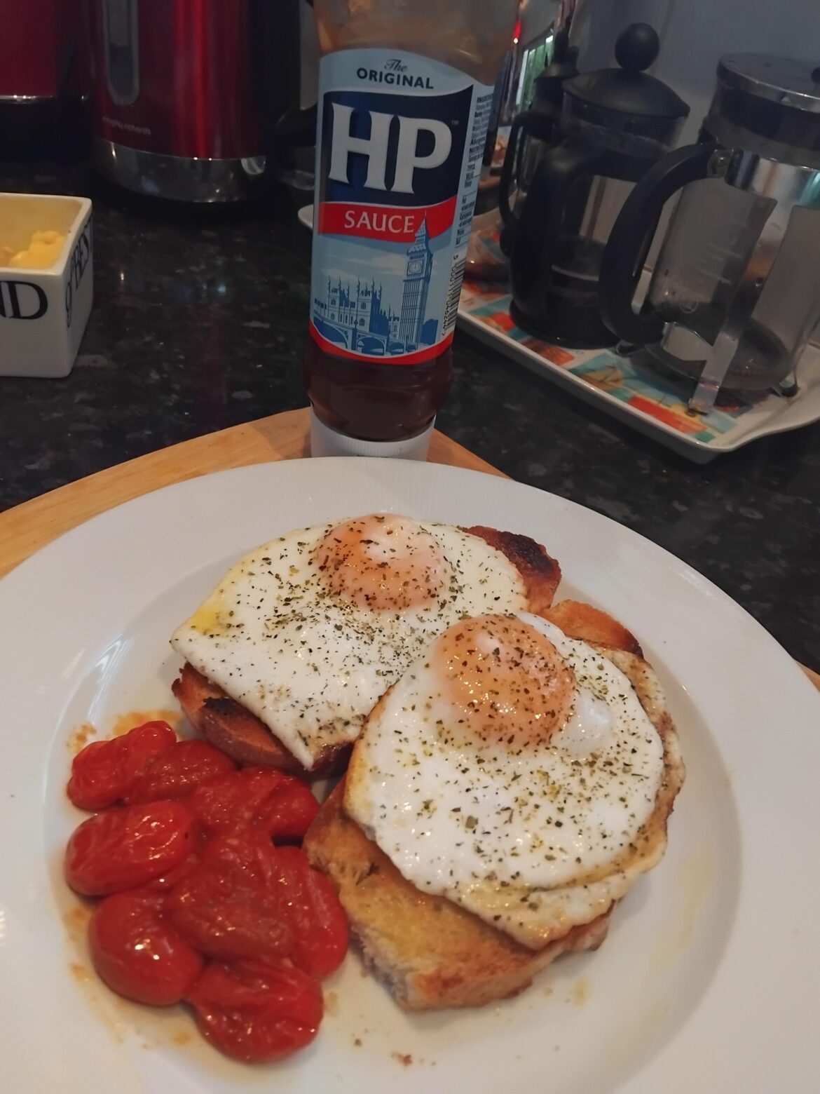 Egg on toast with stewed plum tomatoes.