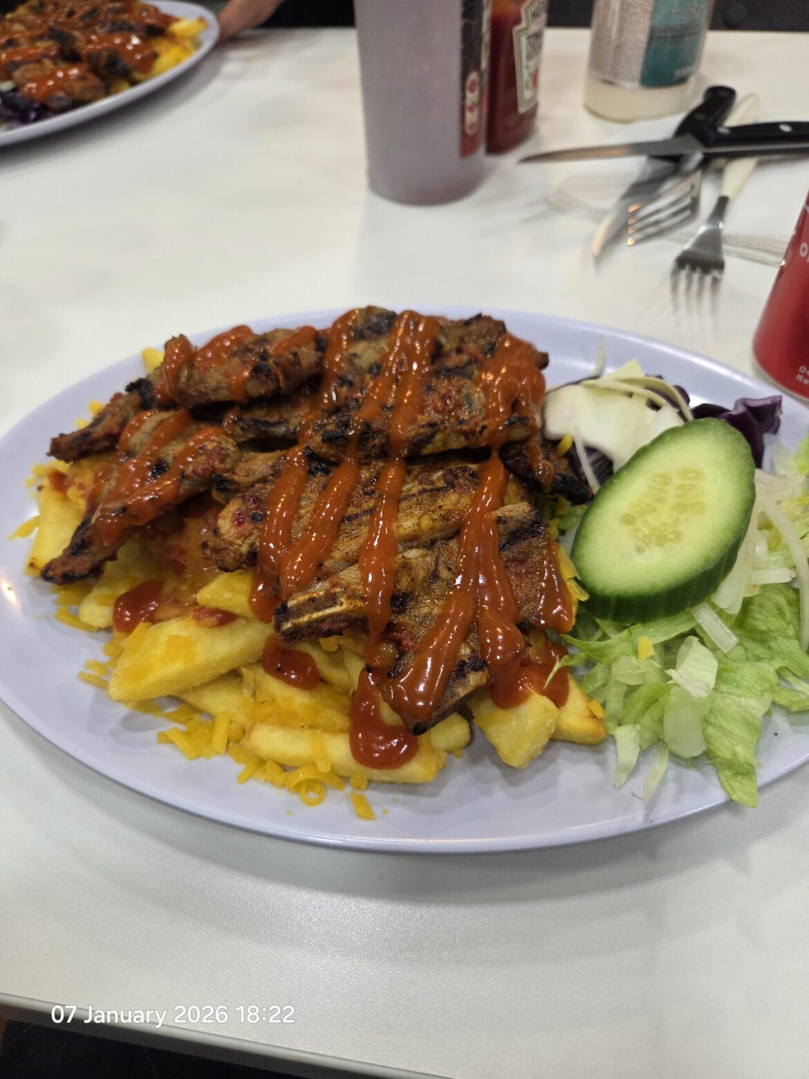 Lamb chops with cheesy chips and gazebo sauce