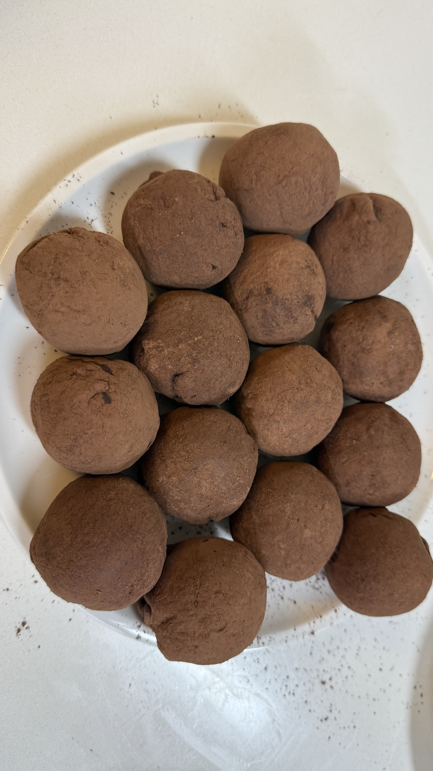 A group of Dubai chewy chocolates, their dents and flaws covered with a dusting of chocolate powder [WOO JI-WON]