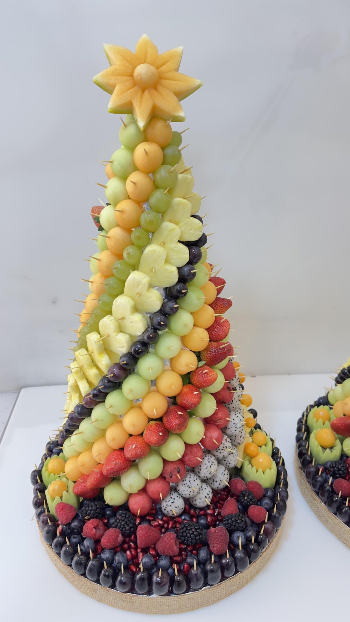 [pro/chef] Fruit tower: melon balls, watermelon balls, pineapple, strawberries, raspberries, and blackberries. Made by me at work.