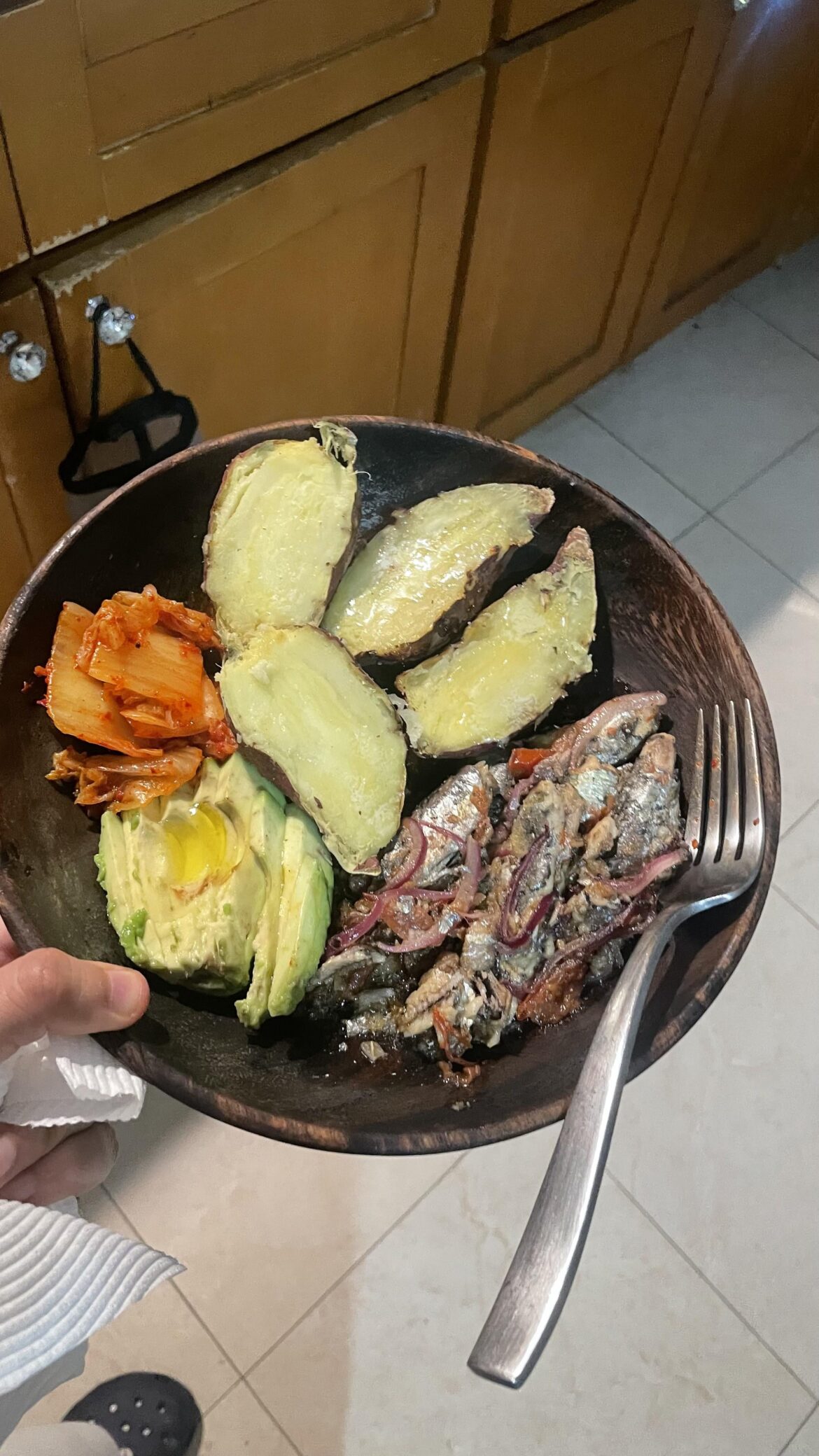 sauteed sardines, japanese sweet potatoes, kimchi, and avocado topped off with olive oil