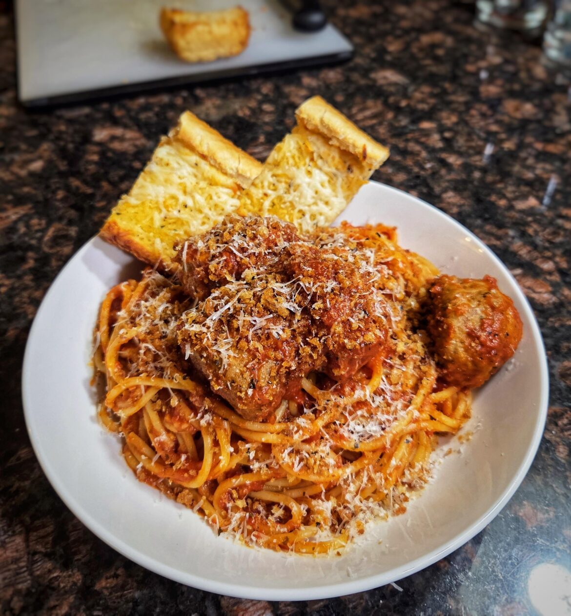New Years Eve spaghetti and meatballs with toasted panko and cheesy garlic bread.