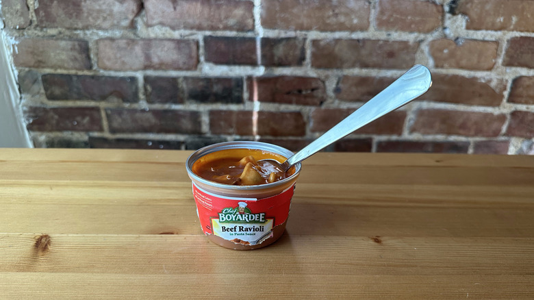 Beef Ravioli with spoon on wooden table