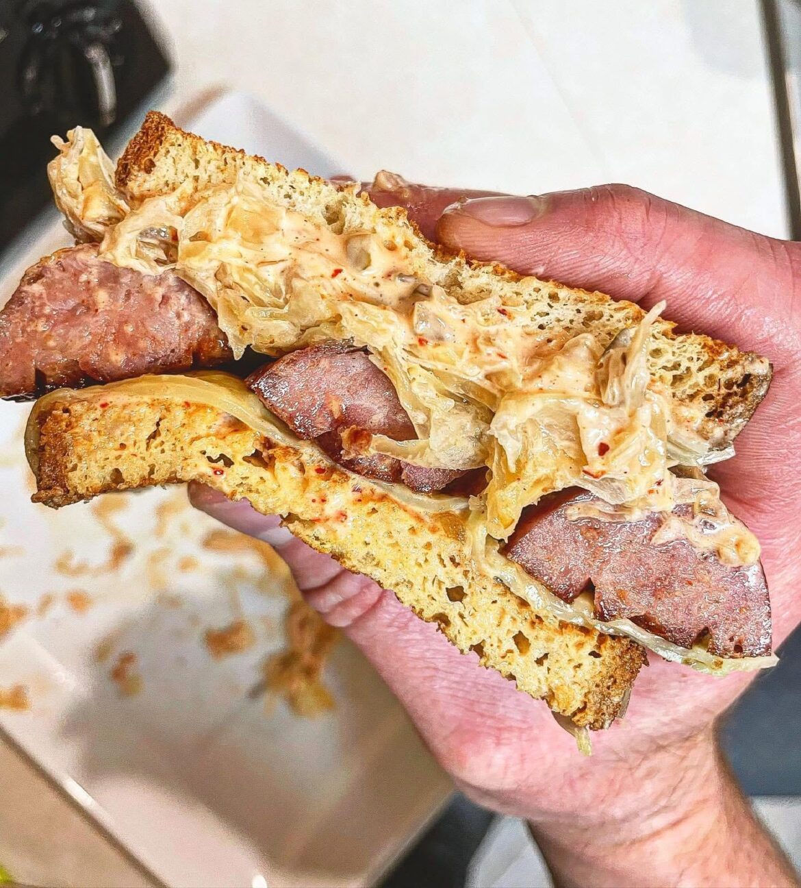 Kielbasa, sauerkraut, Swiss cheese, Russian dressing. Another messy one.