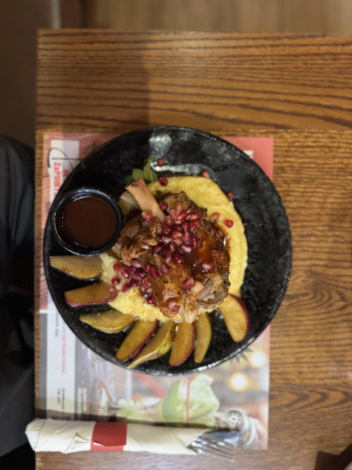 Slow-roasted pork knuckle with pomegranate glaze, served with creamy mashed potatoes and melted cheddar cheese.