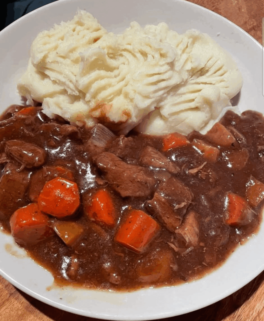 Beef stew done in the slow cooker with shallots and buttery mash
