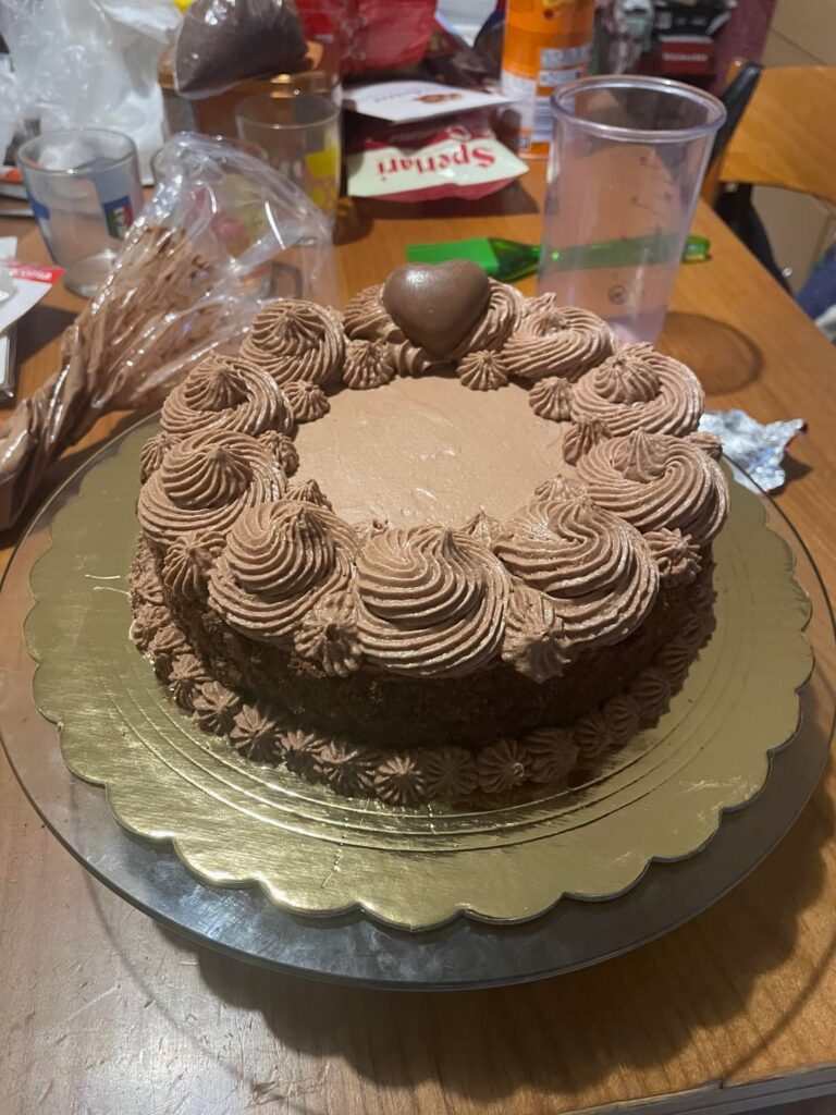 Chocolate cake with chocolate frosting, chocolate cookie crumble and a chocolate heart ❤️