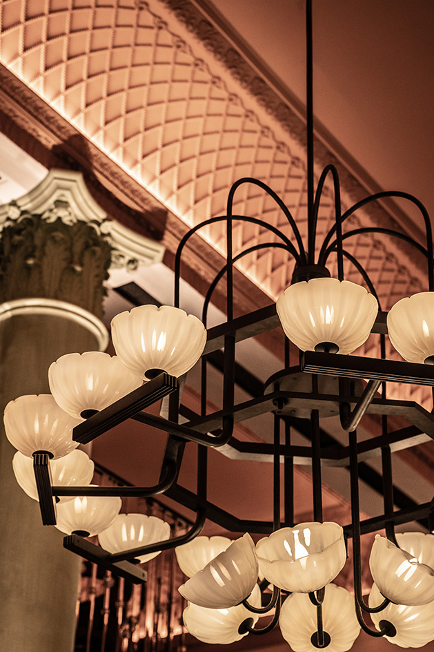 interior of Mezzogiorno by Afroditi in moody light and warm red and brown tones