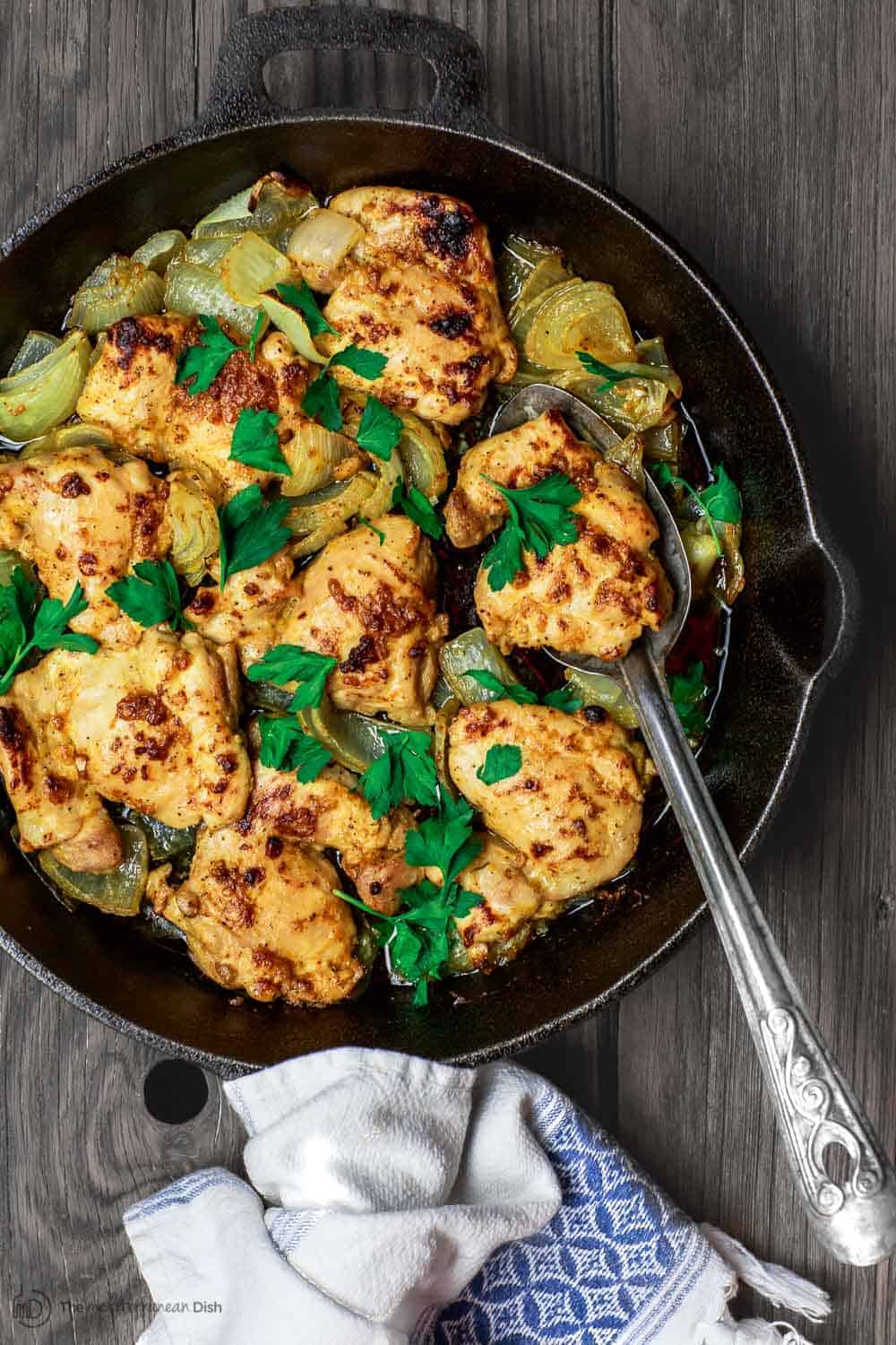 Garlic Dijon Chicken Recipe | The Mediterranean Dish. All-star Dijon chicken recipe. Healthy, gluten free chicken prepared with a light sauce with fresh garlic, Dijon mustard, quality olive oil, honey and warm spices. Bakes in 25 minutes! Recipe comes with suggestions for Mediterranean dishes to serve along! From TheMediterraneanDish.com #chickenrecipes #Mediterraneandiet #healthyrecipes #glutenfree #onepandinner #skilletchicken #skilletrecipes #chickenthighs #chickenthighrecipe