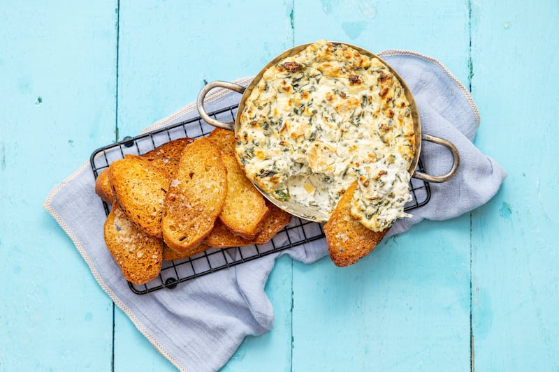 Spinach, artichoke and jalapeño dip with home-made crostini. Photograph: Harry Weir