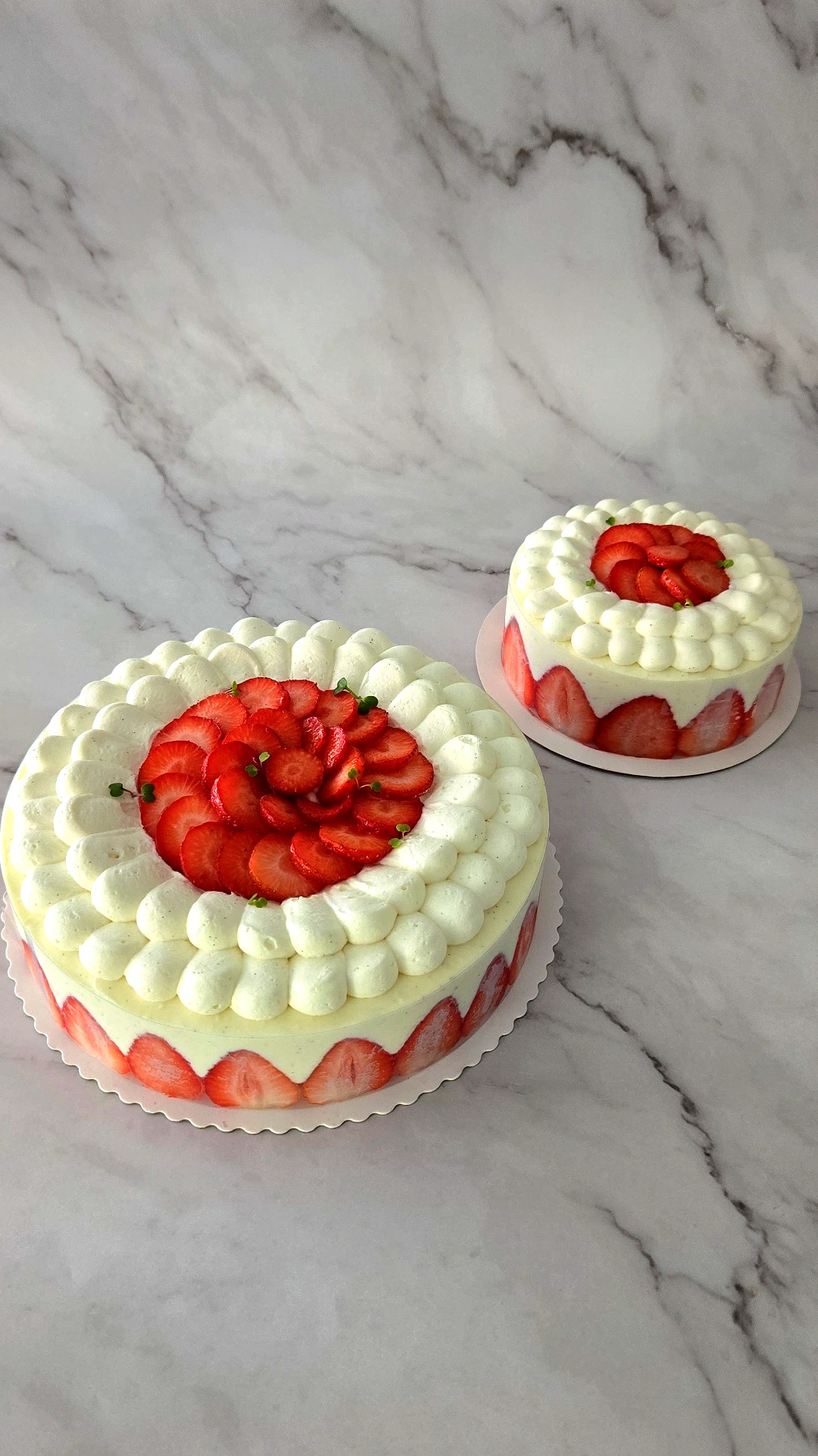 Two cakes with strawberries