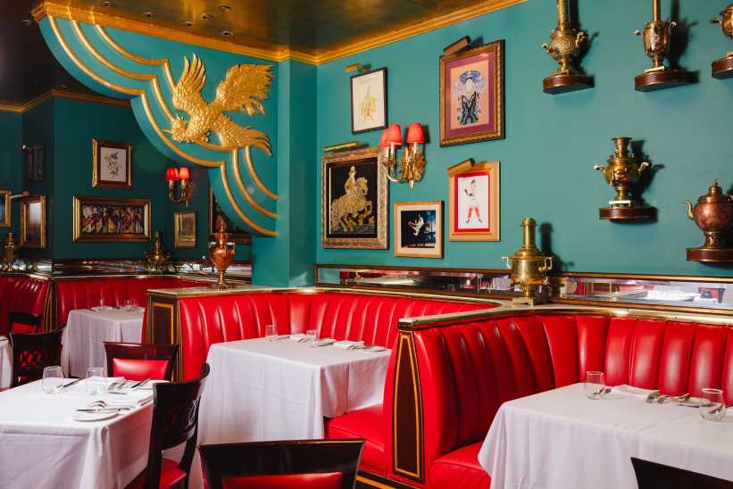 Red booths and turquoise walls in the Russian Tea Room in Manhattan, New York