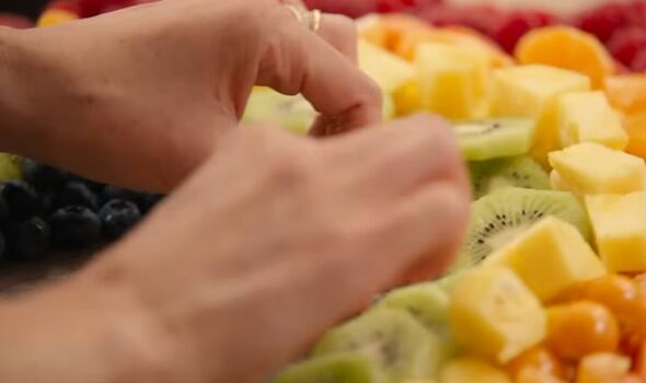 Meghan making a fruit salad