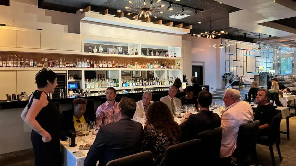 a group of friends gather for dinner with owner Maryann