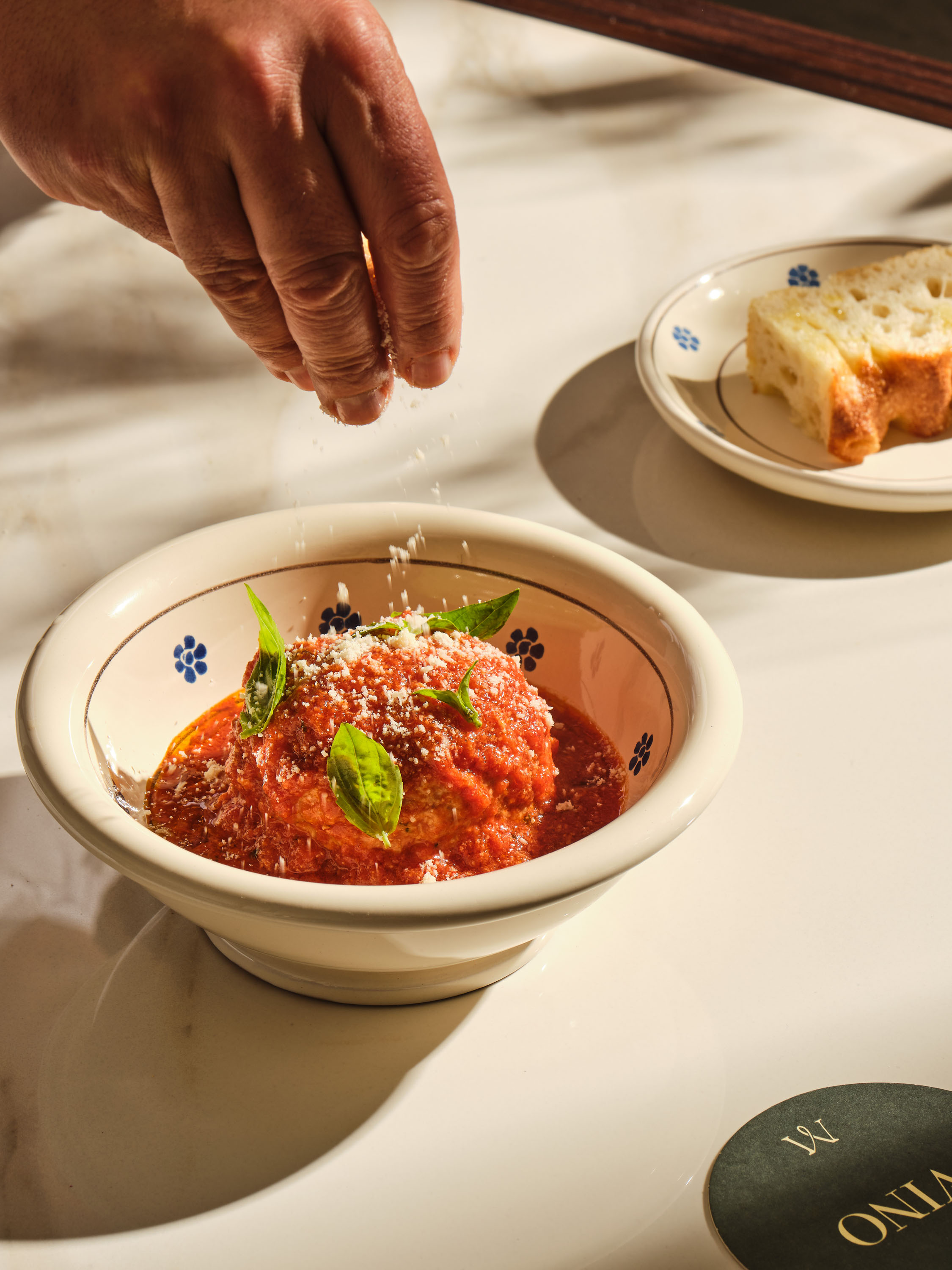 photo of sample dishes at Mezzogiorno restaurant shot from above, lush warm italian past and cakes