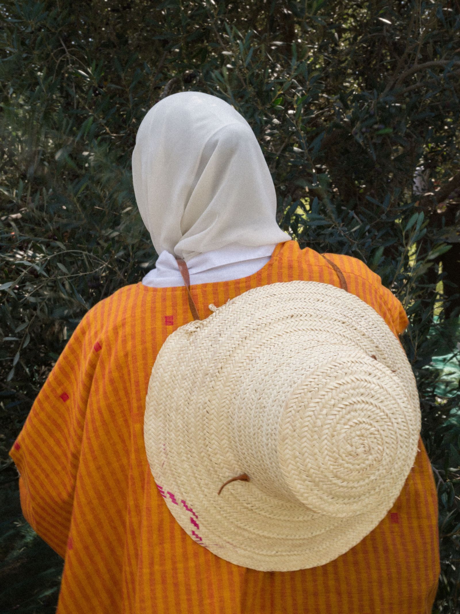 Image may contain Adult Person Clothing Hat Art and Fashion