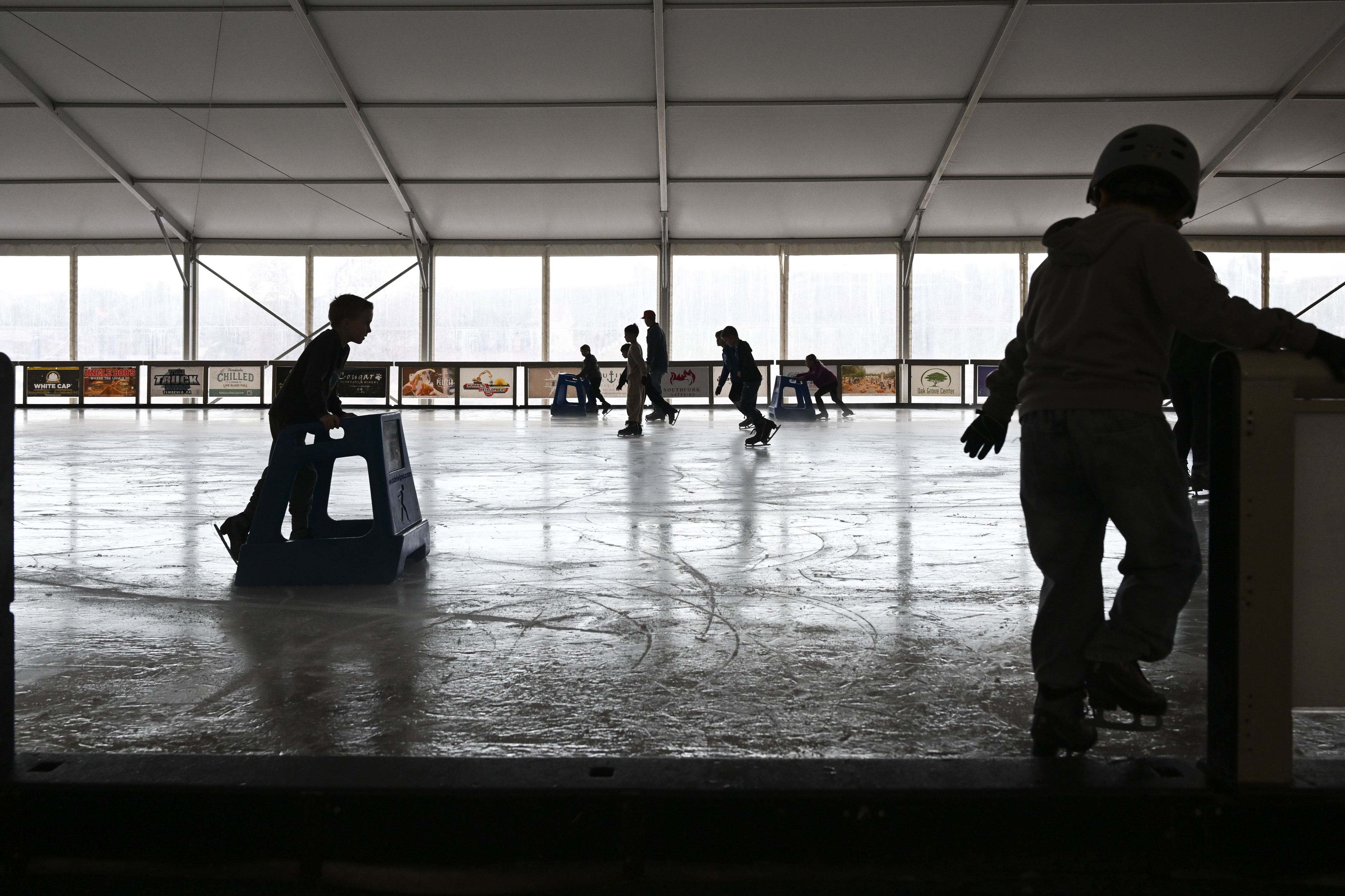 Children and adults enjoy the ice rink at Peltzer Winery...