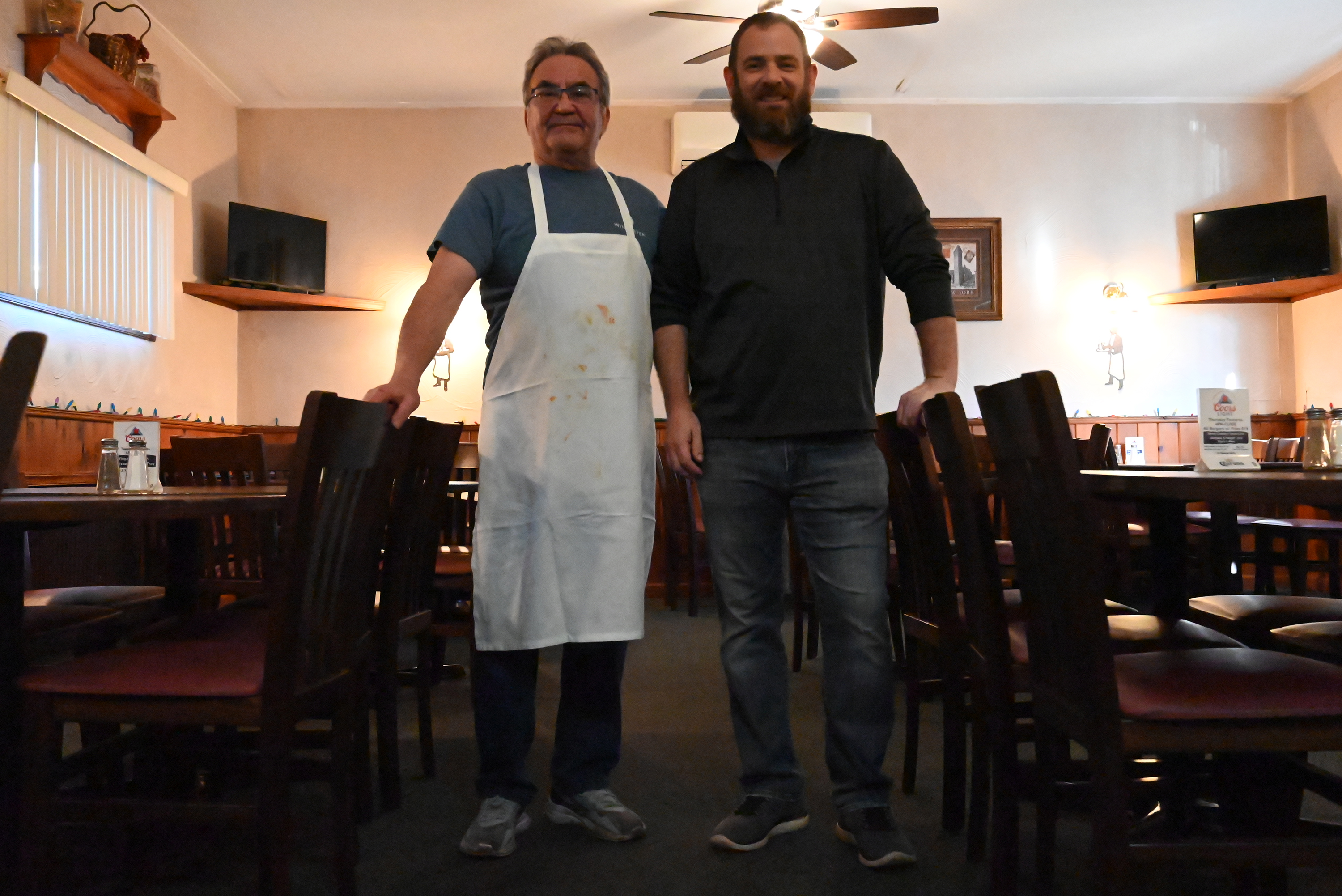 Anthony Salerno stands next to the business’ new owner Jeff...