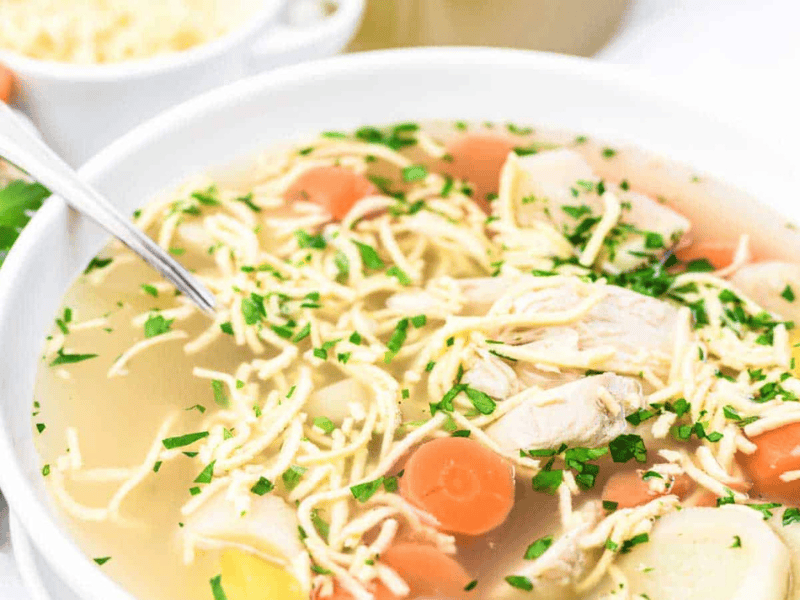 Chicken Noodle Soup with Homemade Keto Egg Noodles in a white bowl.