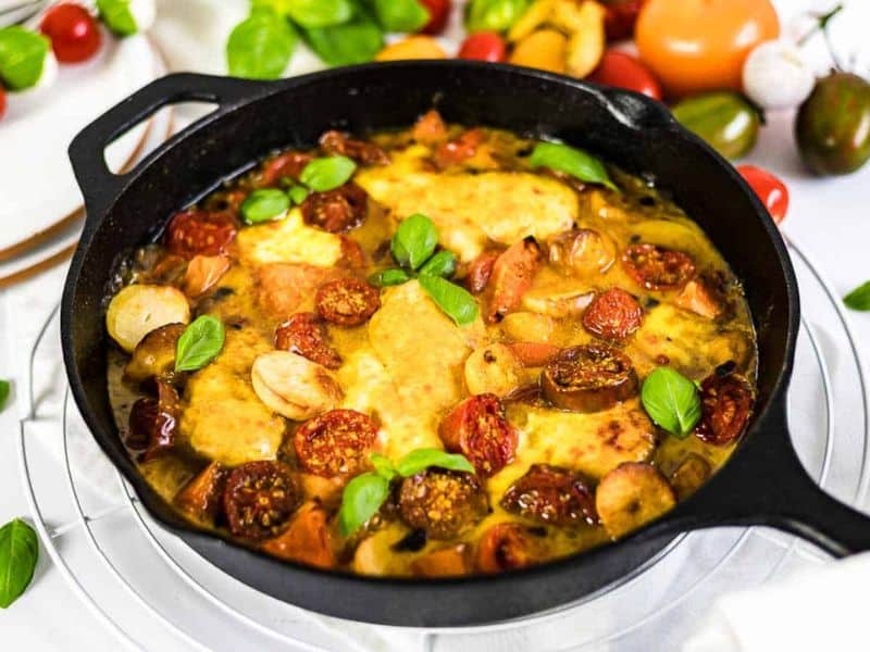 Tomato Mozzarella Baked Chicken inside cast iron.