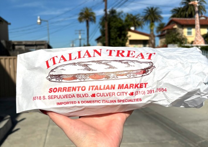 a deli sandwich in a paper bag