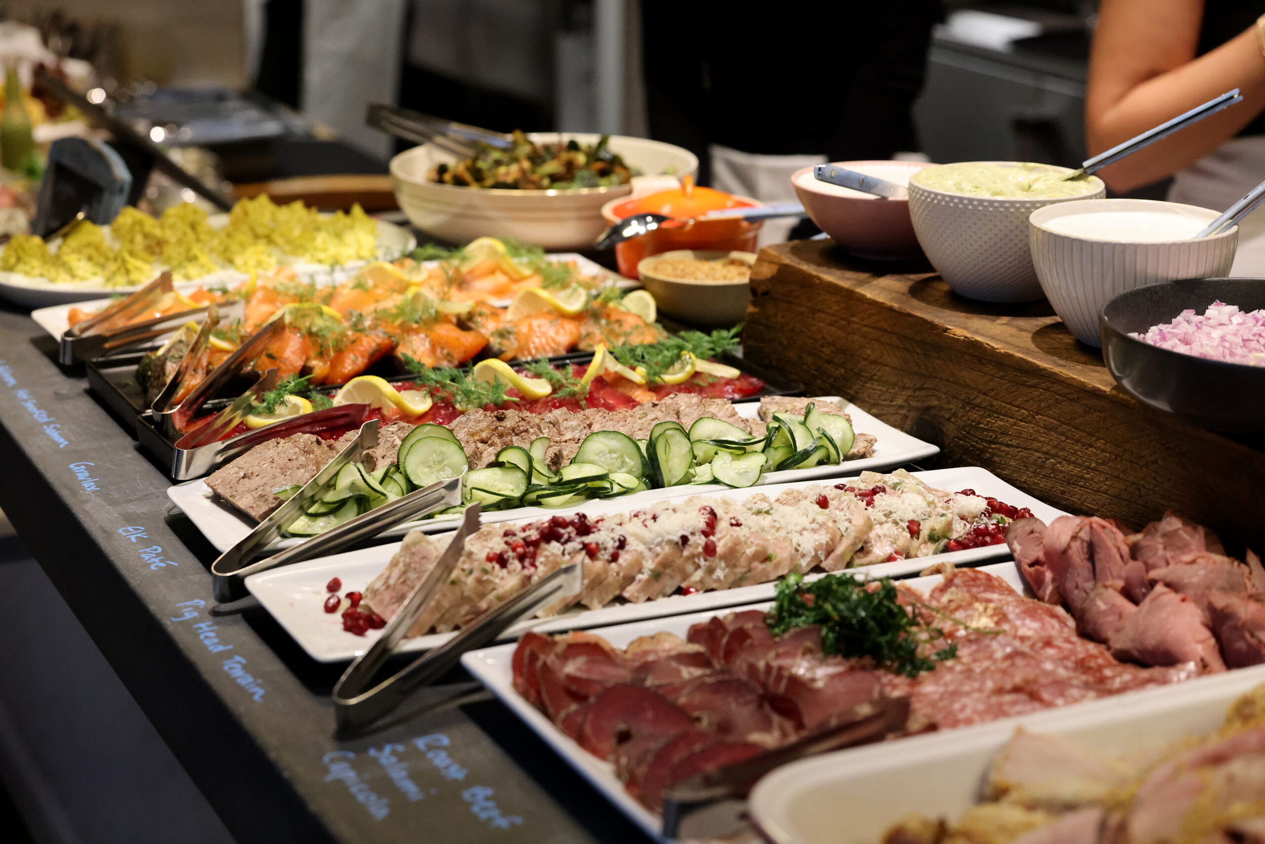 A holiday julbord featuring beet-cured gravlax, cold and hot smoked salmon, charcuterie, elk pate, pig head terrine, and deviled eggs at Stockhome in Petaluma Sunday, Dec. 14, 2025. (Beth Schlanker / The Press Democrat)