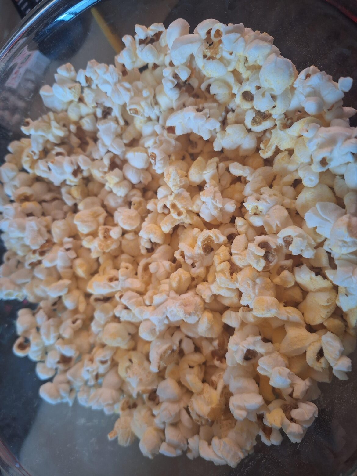 Made cheesy popcorn out of mac and cheese powder and it worked out well