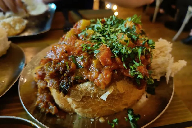 Mowgli's Bunny Chow serves chicken and potato curry inside a loaf of bread
