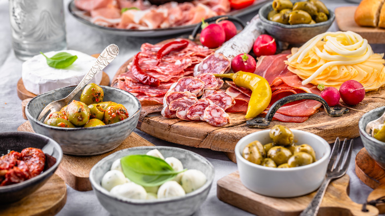 An array of antipasti such as cured meats, cheeses, vegetables, and breads