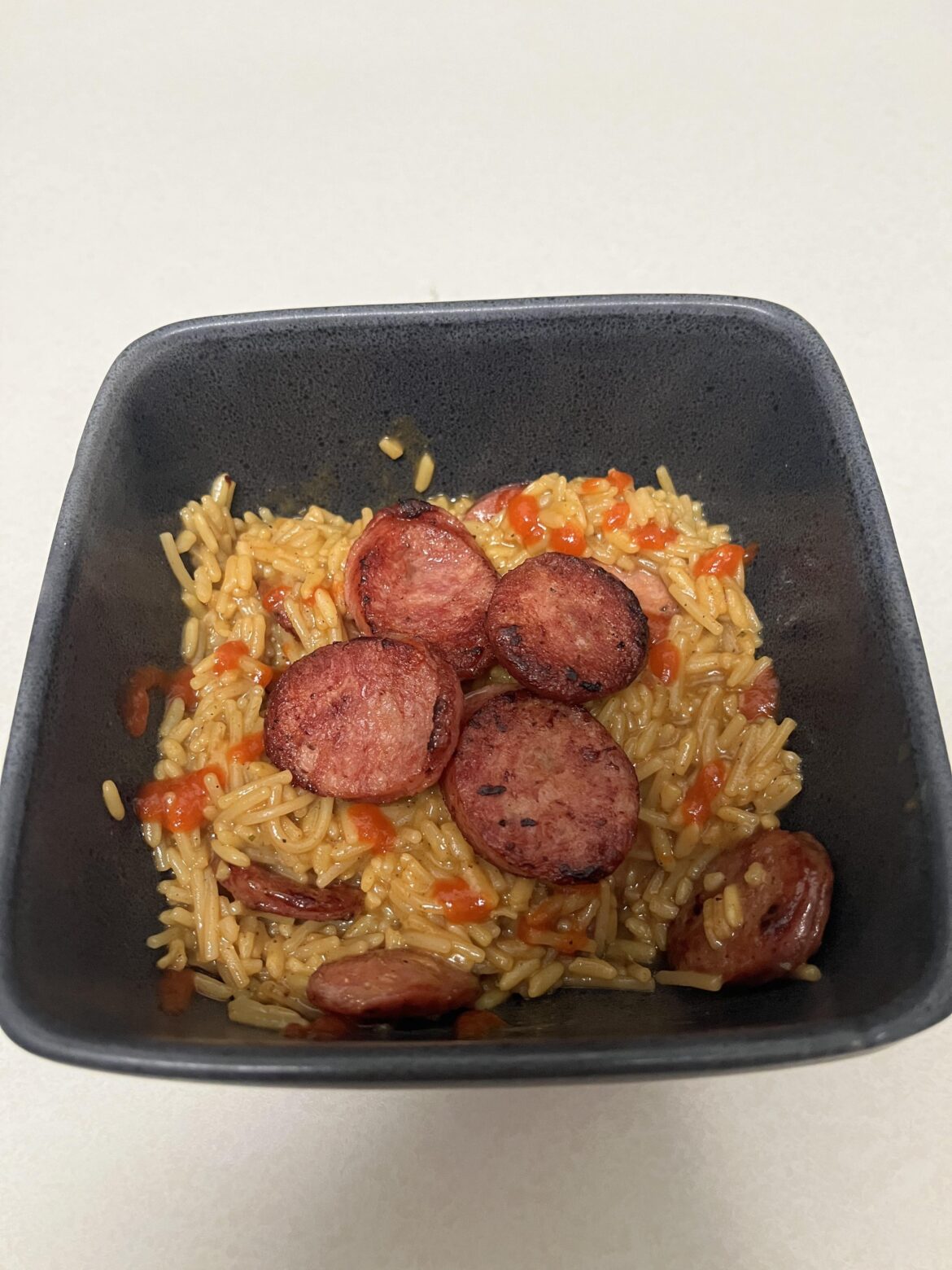 Cajun rice and alligator sausage plus a six pack of Dos Equis