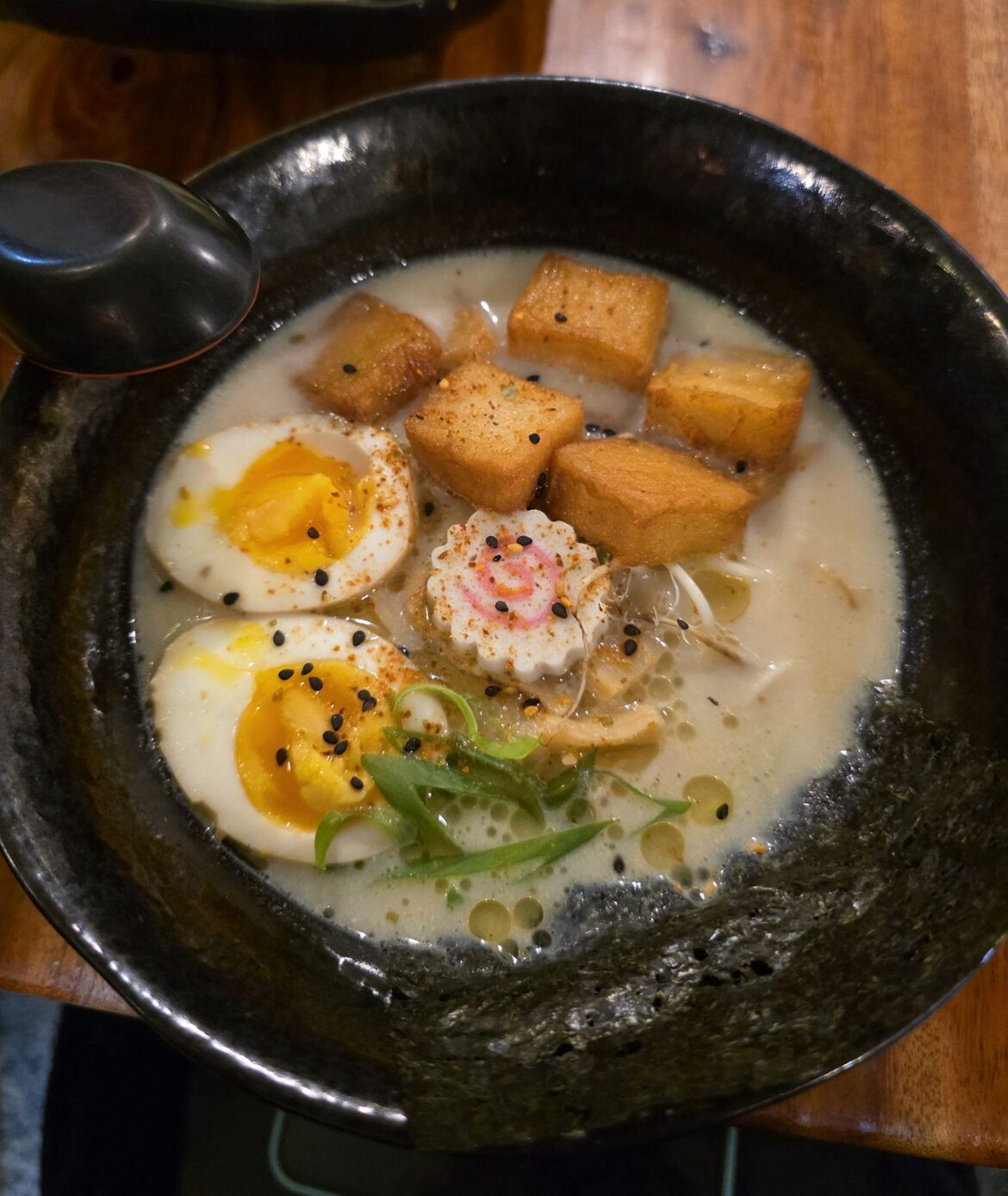 Creamy broth, jammy eggs, crispy tofu cubes, and a hit of umami from sesame and nori 
Simple, comforting, and deeply slurpable.