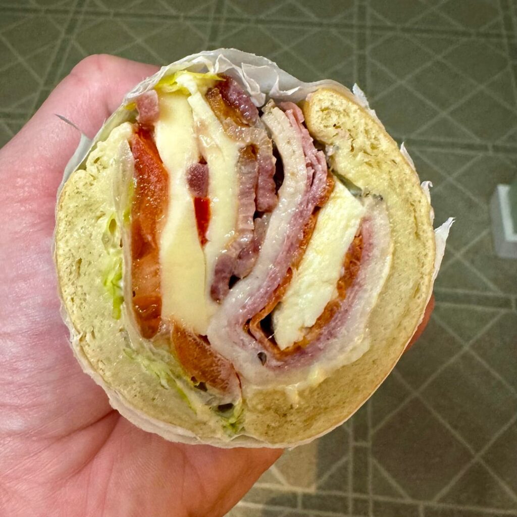 Turkey, salami, pepperoni, bacon, talleggio, burratta, shredduce, tomato, pickled peppers, pickled onions, and garlic sauce on toasted ciabatta. Two constructions. [OC]