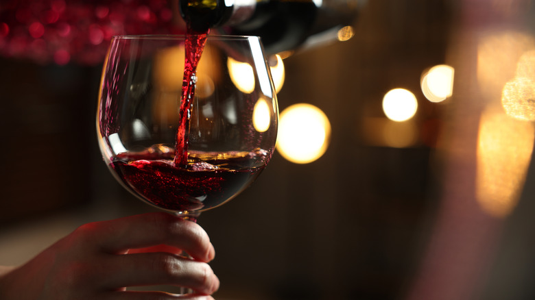 Hand holding a glass of wine