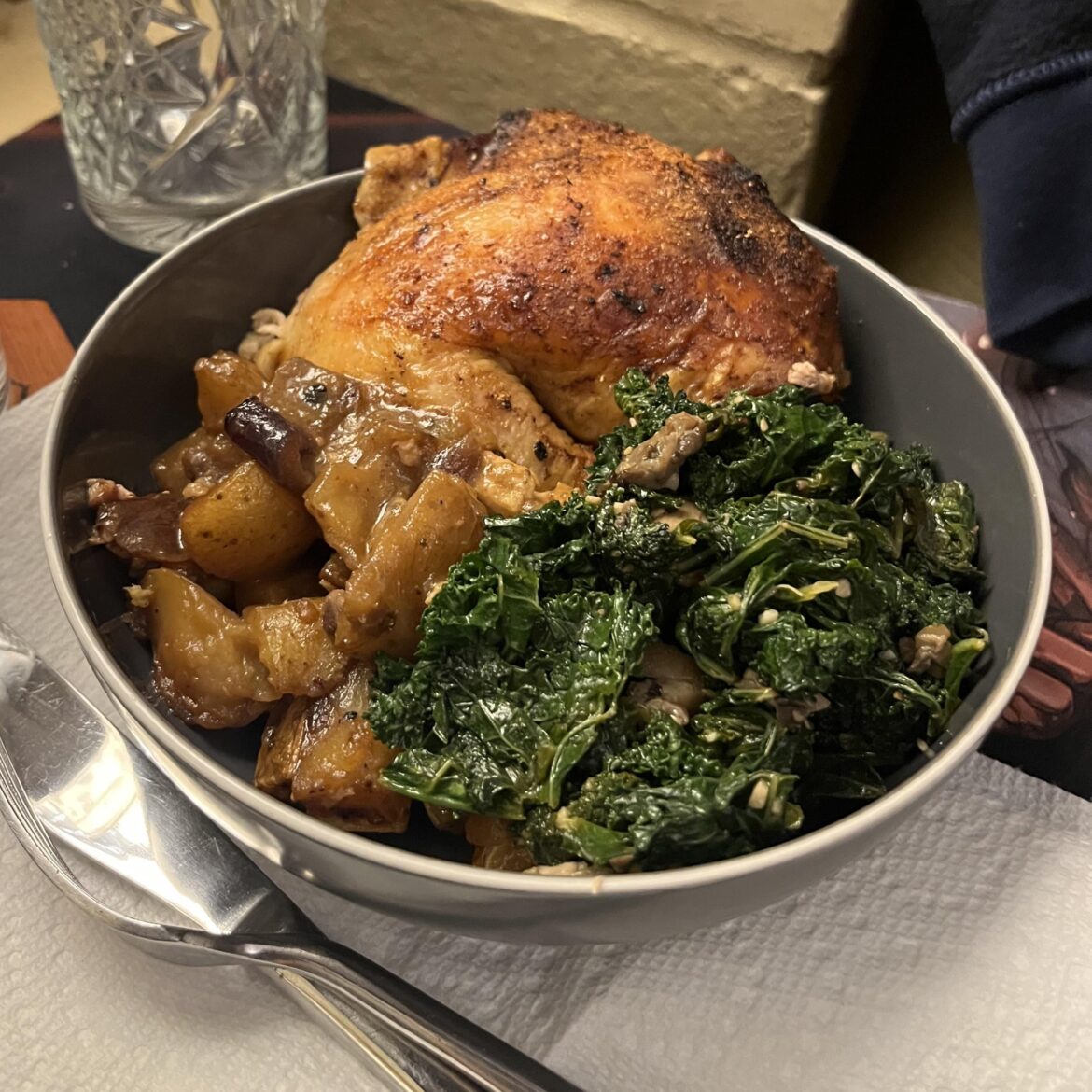 Roast chicken, potatoes and sautéed kale with oyster mushrooms .