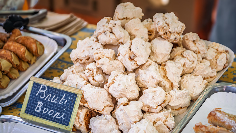 A tray of brutti ma buoni cookies at a bakery