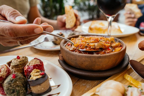 Food and drink are abundant at a traditional Georgian supra.