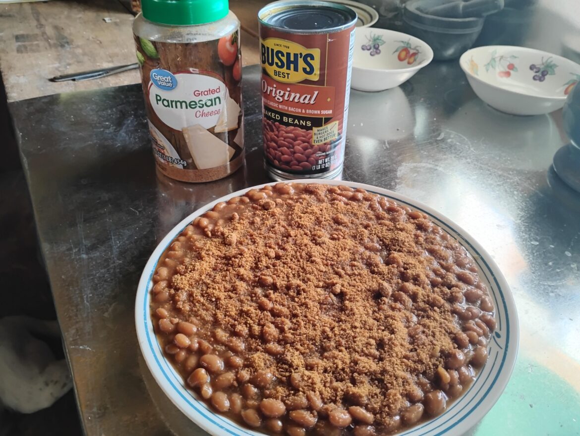 Today's ration: a big plate of beans topped with prehistoric Parmesan cheese, cheese was same color as the beans. Total 950 calories for today.
